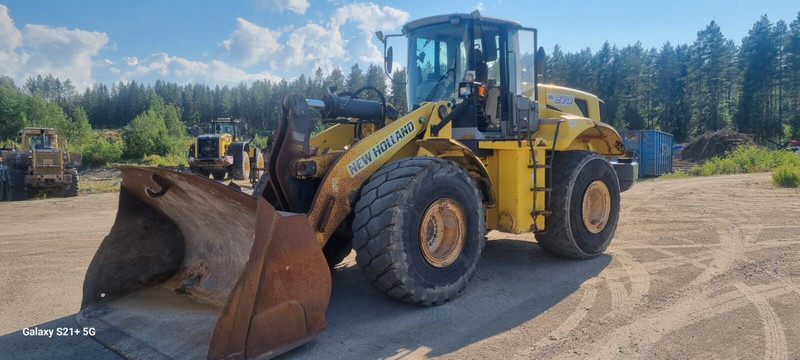 New Holland W270 - اللودر بعجل: صورة 1 New Holland W270 - اللودر بعجل: صورة 1