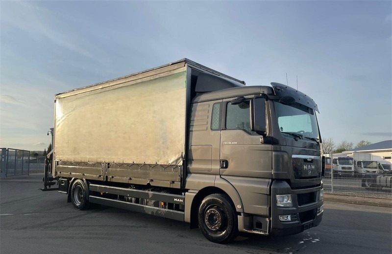 MAN TGX 18.400 Curtain Sider + Crane Palfinger 14002 EH - شاحنة مقفلة: صورة 1 MAN TGX 18.400 Curtain Sider + Crane Palfinger 14002 EH - شاحنة مقفلة: صورة 1