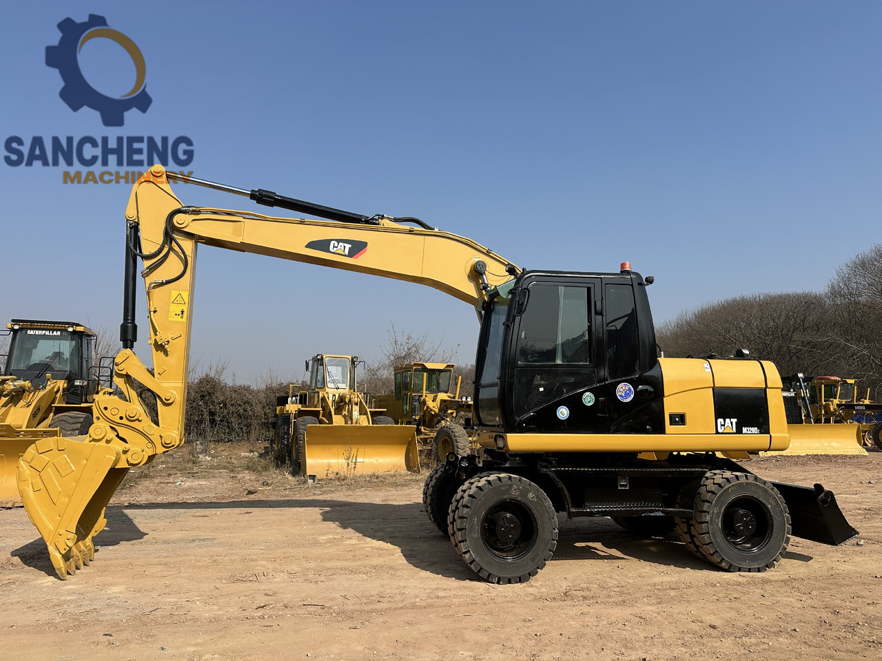 CATERPILLAR M320D2 - حفارة دولاب: صورة 2 CATERPILLAR M320D2 - حفارة دولاب: صورة 2
