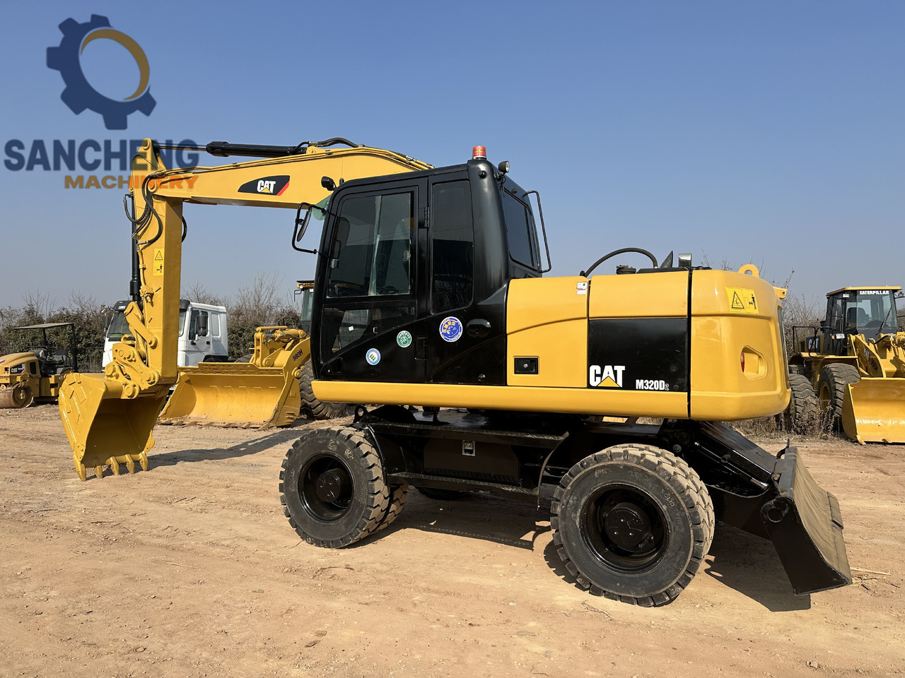 CATERPILLAR M320D2 - حفارة دولاب: صورة 1 CATERPILLAR M320D2 - حفارة دولاب: صورة 1