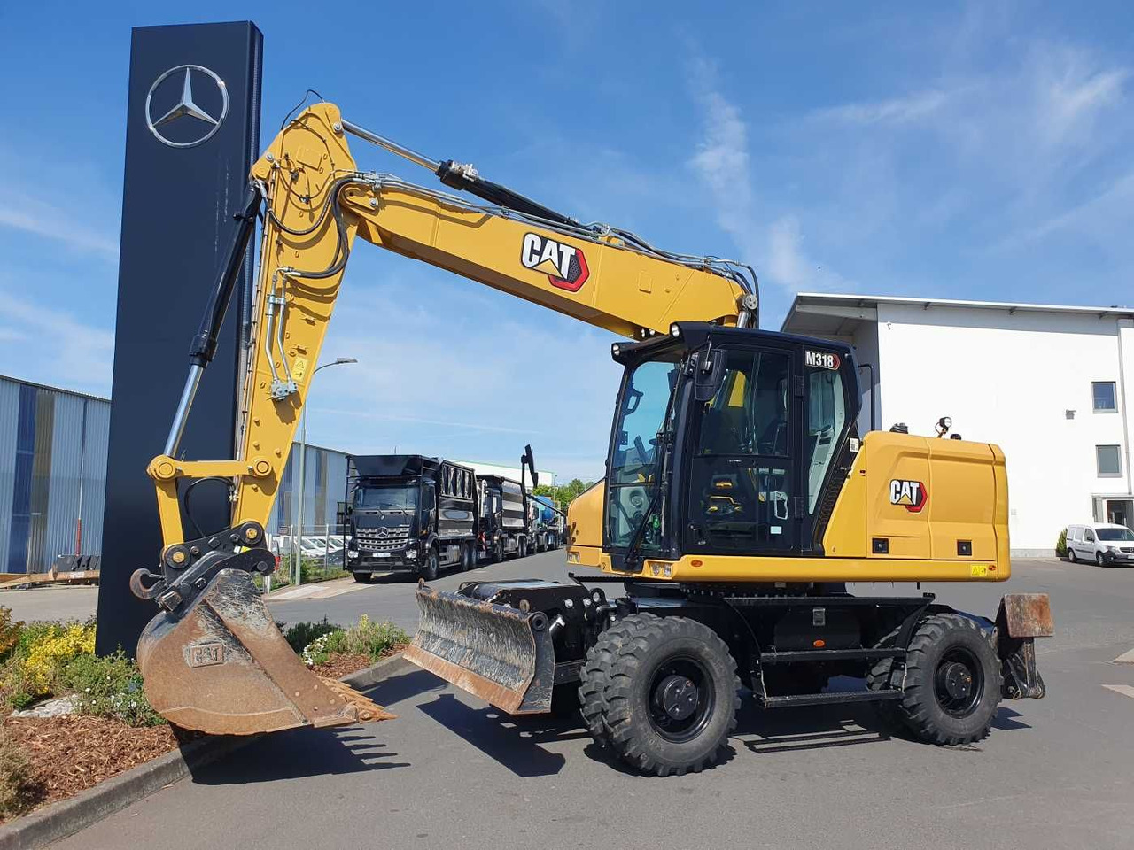 CAT M318 / 2022 / nur 286h! / Tieflöffel / Pratzen - حفارة دولاب: صورة 1 CAT M318 / 2022 / nur 286h! / Tieflöffel / Pratzen - حفارة دولاب: صورة 1