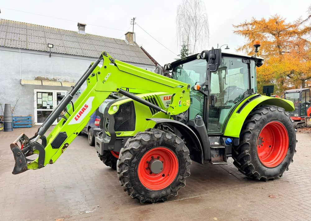 Claas Arion 420 - جرار: صورة 1 Claas Arion 420 - جرار: صورة 1