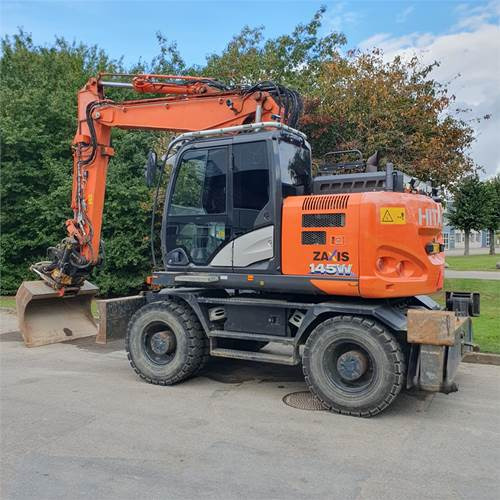 Hitachi ZX145 WT-6 - حفارة دولاب: صورة 1 Hitachi ZX145 WT-6 - حفارة دولاب: صورة 1