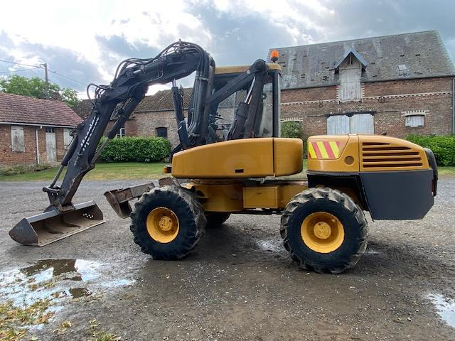 Mecalac 12 MXT - حفارة دولاب: صورة 1 Mecalac 12 MXT - حفارة دولاب: صورة 1