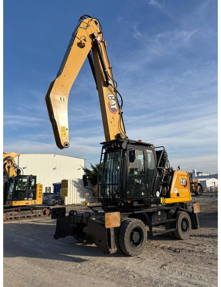 CAT MH3024 - حفارة دولاب: صورة 1 CAT MH3024 - حفارة دولاب: صورة 1