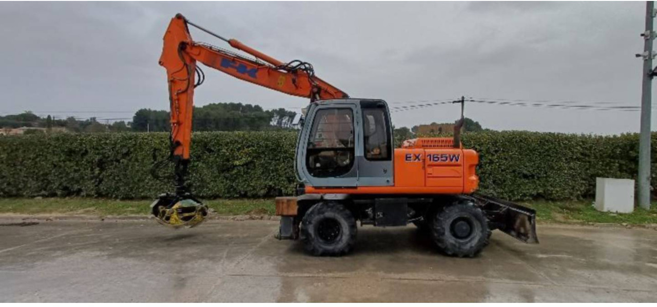 FIAT ALLIS / NEW HOLLAND EX165W - حفارة دولاب: صورة 1 FIAT ALLIS / NEW HOLLAND EX165W - حفارة دولاب: صورة 1