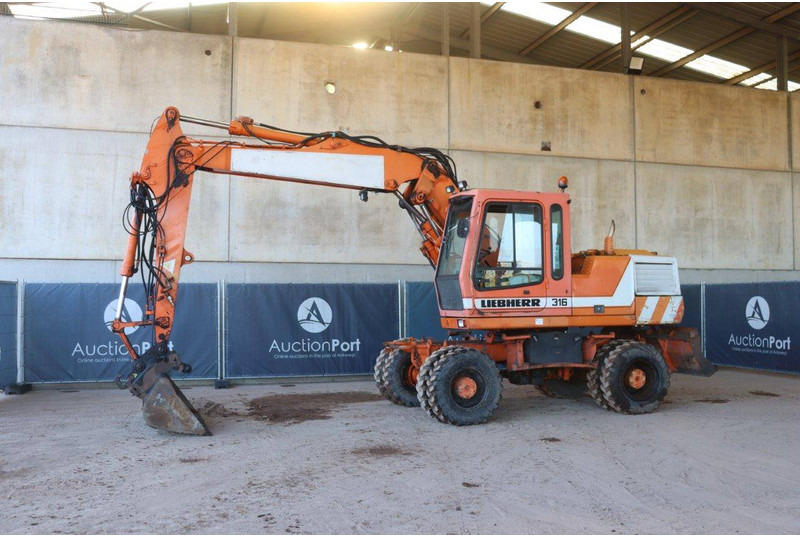 Liebherr A316 - حفارة دولاب: صورة 1 Liebherr A316 - حفارة دولاب: صورة 1
