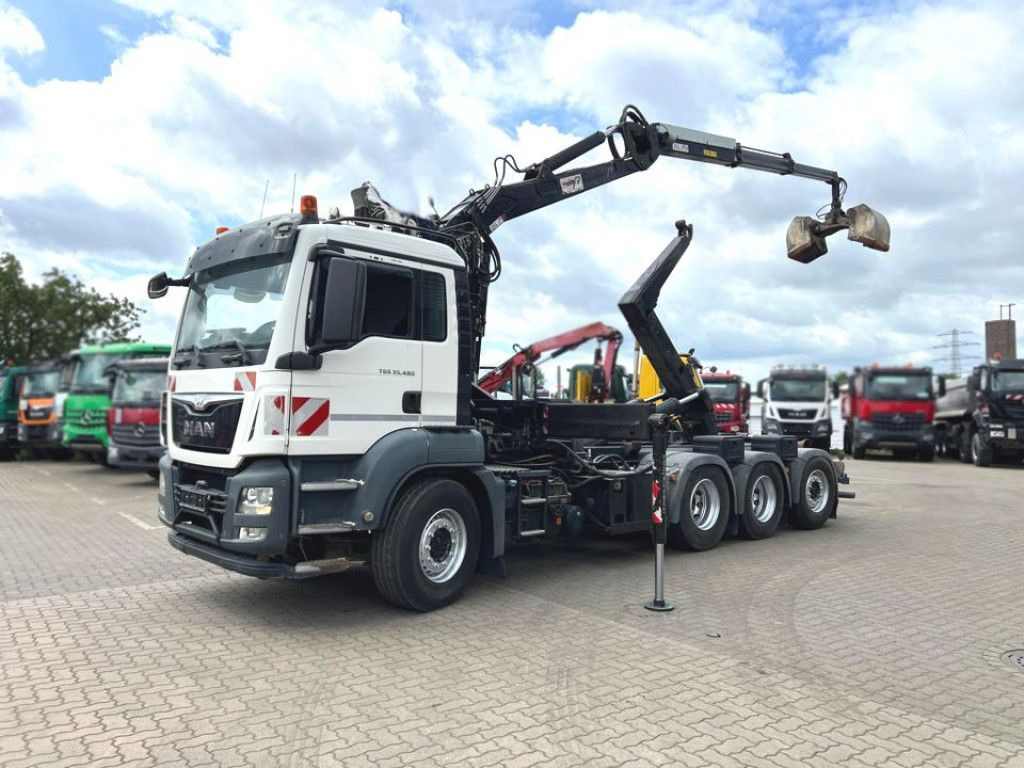 MAN TG-S 35.480 8x4 BL Abrollkipper mit Kran Penz-15 - شاحنة ذات خطاف, شاحنة كرين: صورة 1 MAN TG-S 35.480 8x4 BL Abrollkipper mit Kran Penz-15 - شاحنة ذات خطاف, شاحنة كرين: صورة 1