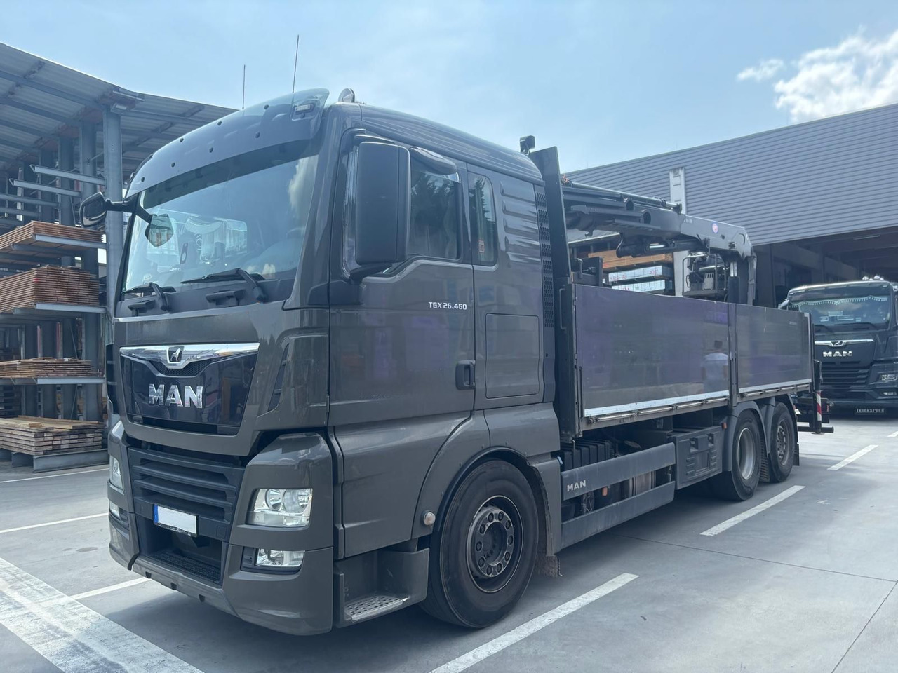 MAN 26.460 TGX Baustoffkran HMF 2110-L3 - شاحنة كرين: صورة 1 MAN 26.460 TGX Baustoffkran HMF 2110-L3 - شاحنة كرين: صورة 1
